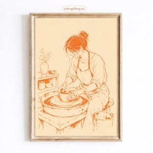 May include: A framed art print featuring a monochromatic orange line drawing of a person working at a pottery wheel. The illustration depicts a figure in an apron shaping a clay bowl on a wheel, with a vase and small bowls on a shelf nearby.