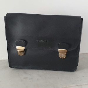 Black leather backpack — structured 90s design