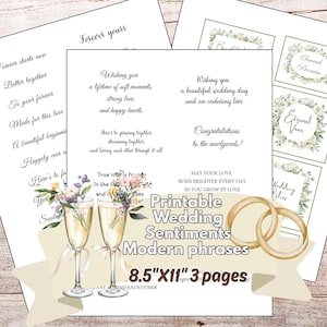 Könnte beinhalten: Ein Set aus drei druckbaren Hochzeits-Sentiment-Seiten im Format 21,6 x 27,9 cm. Die Seiten enthalten schwarzen Text mit Phrasen wie Wishing you a lifetime of soft moments, zwei Champagnergläser mit Blumen und zwei goldene Ringe auf einem Banner.