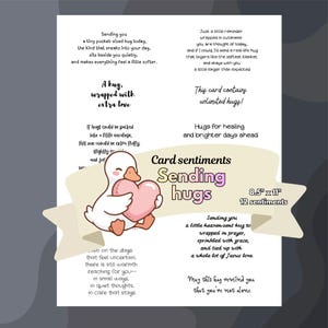 Op de afbeelding: Een witte kaart met de tekst "Card sentiments Sending hugs" en een cartoon eend met een roze hart. De kaart meet 21,6 cm x 27,9 cm en bevat 12 sentimenten. Diverse tekstfragmenten zijn opgenomen.