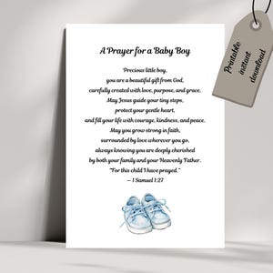 May include: A white print with the text "A Prayer for a Baby Boy" and a watercolor illustration of baby shoes. The print includes a prayer for a baby boy and a tag that says "Printable instant download."