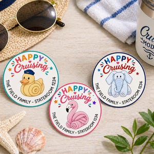 May include: Three round cruise-themed stickers with the text "Happy Cruising" and illustrations of a duck, an elephant, and a flamingo. The stickers also include the text "The Field Family - Stateroom 1234".