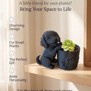 May include: A black Cockapoo planter with a small green plant. The planter is shaped like a dog and has a matching black pot with a dog design. Text on the image reads "Cockapoo Planter".