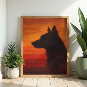 May include: A framed painting of a dog silhouette against a sunset backdrop. The artwork features a dark dog profile set against a gradient of orange, yellow, and red hues. The wooden frame adds a natural touch to the piece.