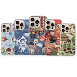 May include: A collection of five phone cases with unique designs. Each case features a clear border and a different pattern, including illustrations of dolls, bears, and other whimsical characters. The cases have a variety of colors, including blue, red, and green.