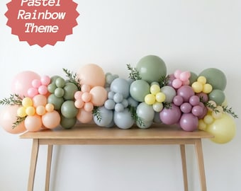 Kit de decoração para chá de bebê em tons pastel com guirlanda, arco e arranjo para festa, balões e painel de fundo para aniversário com tema arco-íris pastel.