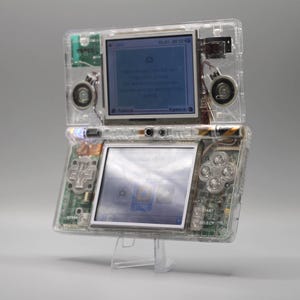 Refurbished Nintendo DSi with transparent case, new touchscreen, usb charger and carrying case