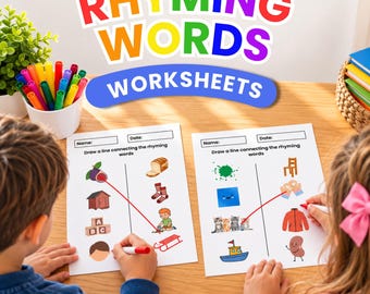 May include: Two white worksheets titled RHYMING WORDS WORKSHEETS with illustrations of objects like a fig, bread, and cats. The worksheets feature a matching exercise where lines connect rhyming images. Colorful markers are in a white cup nearby.