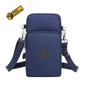 May include: A navy blue vertical crossbody bag with two zippered compartments, a detachable adjustable shoulder strap, and a circular logo patch on the front featuring the text MINGSHUO. The bag is made of a smooth, solid-colored fabric material.