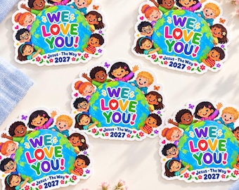May include: Five identical circular stickers featuring a cartoon globe surrounded by diverse children. The text reads WE LOVE YOU! Jesus - The Way 2027. The design includes colorful flowers, butterflies, and hearts on a white background.