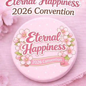 May include: A pink button with the words "Eternal Happiness 2026 Convention" in a decorative font. The button is decorated with pink cherry blossoms and white polka dots.