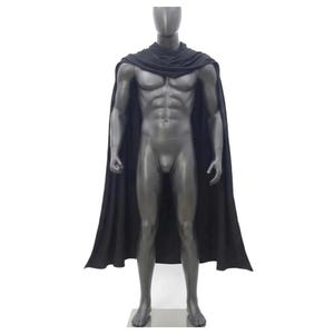 May include: A solid black cape featuring a draped cowl neckline that rests around the shoulders. The garment is displayed on a dark gray, muscular, featureless mannequin, extending down to the lower legs with a smooth, flowing fabric drape.