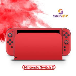 Könnte beinhalten: Eine rote Nintendo Switch 2 Spielkonsole mit passender roter Dockingstation. Das Gerät enthält rote Joy-Con-Controller mit schwarzen Tasten und Joysticks. Das Skinify-Logo befindet sich oben rechts und der Text Nintendo Switch 2 steht darunter.