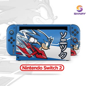 May include: A blue Nintendo Switch 2 console with a custom skin featuring Sonic the Hedgehog. The skin has a blue and white background with Japanese text and red accents. The console is set against a white background.