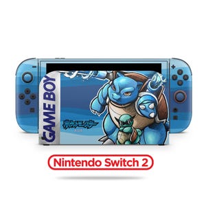 May include: A blue Nintendo Switch console with a custom design featuring a blue cartoon turtle character. The screen displays a matching graphic with the text "GAME BOY" and Japanese characters. The console has blue controllers and the text "Nintendo Switch 2".