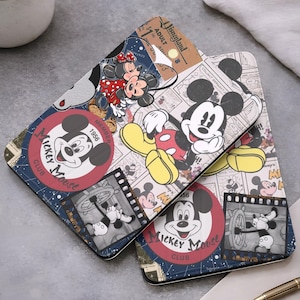 May include: Two phone cases with a vintage Mickey Mouse design. The cases feature Mickey Mouse in various poses, along with the text "Mickey Mouse Club" and "Disneyland". The color scheme includes red, yellow, black, and blue.