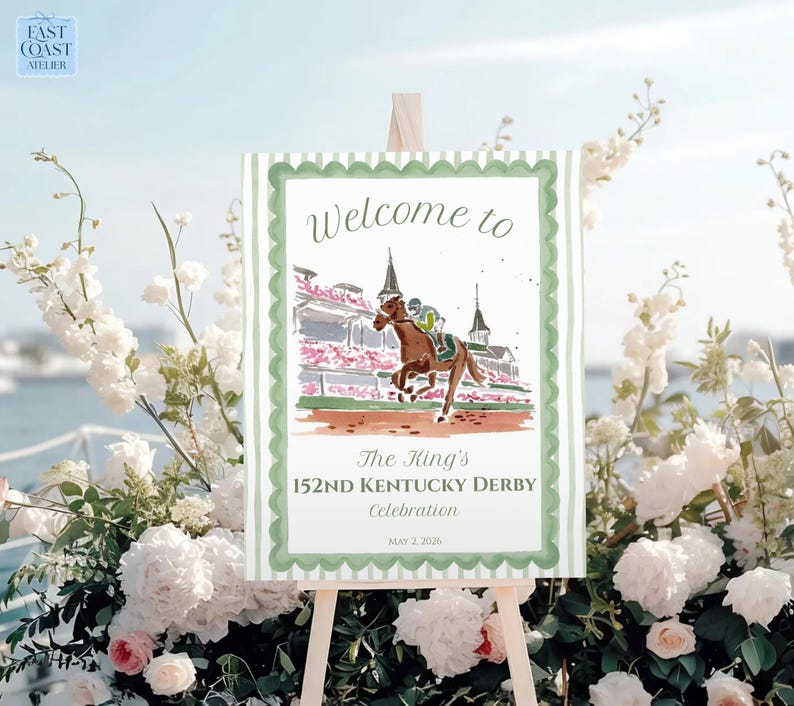 May include: A sign on an easel with the text "Welcome to" and "The King's 152ND Kentucky Derby Celebration" with a watercolor illustration of a horse race. The sign has a green border and is surrounded by white flowers.