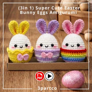May include: Three crocheted Easter bunny egg amigurumi in a cardboard box. Each egg is white with a different color scheme: yellow, purple, and rainbow. The eggs have black eyes, a smiling mouth, and pink cheeks. The text "(3in 1) Super Cute Easter Bunny Eggs Amigurumi" is at the top.