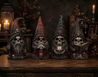 May include: Four skull-faced gnome figurines wearing pointed hats with dark, weathered textures. The figures feature intricate details including a staff with a red crystal, a lantern, a small skull, and an open book with a pentagram symbol.