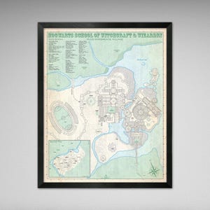 May include: A framed map of Hogwarts School of Witchcraft & Wizardry, plus Hogsmeade Village. The map features a detailed illustration of the castle, surrounding grounds, and a compass rose. The map is framed in a black border.