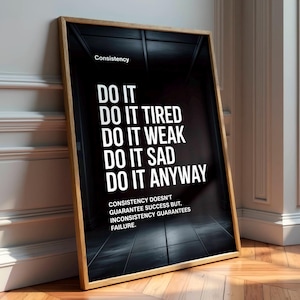 May include: A framed motivational poster with a black background and white text. The poster reads "DO IT" followed by "DO IT TIRED, WEAK, SAD, ANYWAY." The text "Consistency" is at the top, and a quote about consistency is at the bottom.