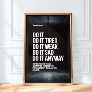 May include: Framed motivational poster with a black background and white text. The poster reads "DO IT" followed by "DO IT TIRED, WEAK, SAD, ANYWAY." The word "Consistency" is at the top. The bottom text states "Consistency doesn't guarantee success but, inconsistency guarantees failure."