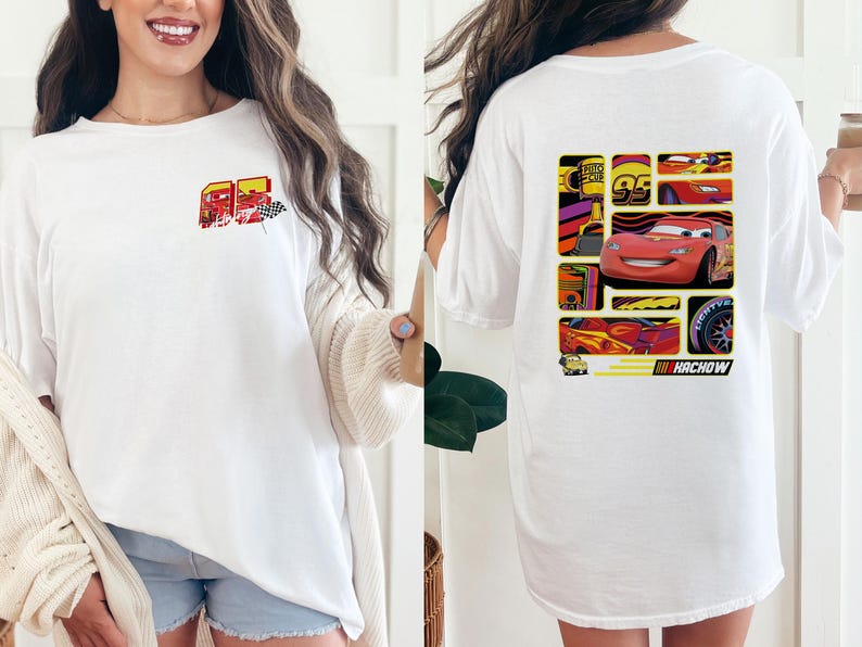 May include: White t-shirt featuring a colorful graphic of a race car and the number 95 on the front. The back of the shirt displays a collage of race car images and the word "Kachow". A fun, casual tee for fans of animated car racing.