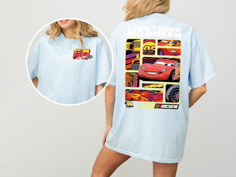 May include: Light blue t-shirt featuring a graphic of Lightning McQueen from the movie Cars. The back of the shirt displays a collage of images of the character and the text "Lightning McQueen" and "Hachow". The front of the shirt has a smaller graphic of the character.