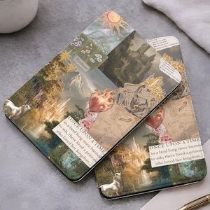 May include: Two fantasy-themed tablet cases with a collage design. The cases feature illustrations of a deer, a castle, a heart with flames, and a sun. Text includes "Fireheart" and "ONCE UPON A TIME in a land long since burned to ash, there lived a princess who loved her kingdom..."