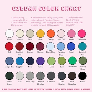 May include: A Gildan color chart with a pink background displays a variety of colors, including white, red, and navy. The chart includes information on sizing, fabric weight, and material composition. Text at the bottom encourages customers to send a message if a color is not listed.