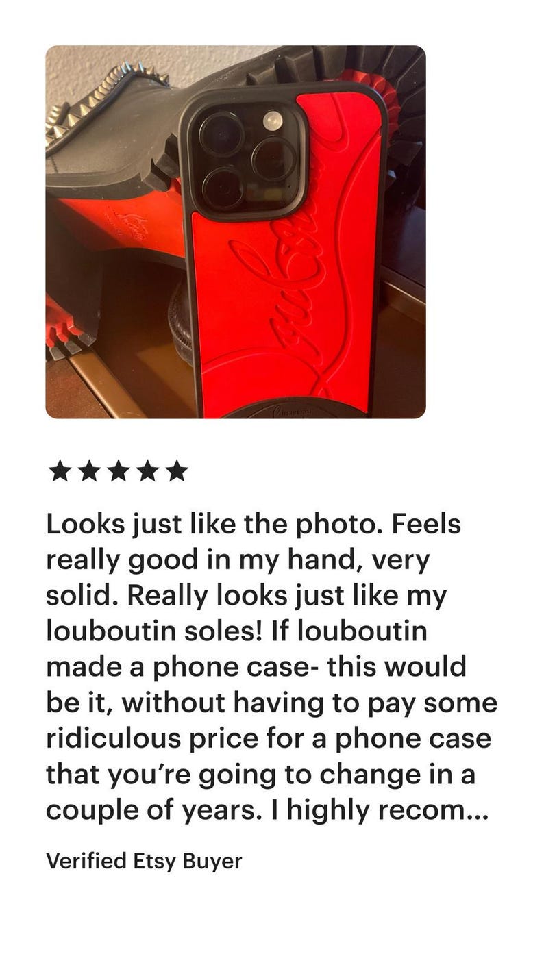 May include: Red phone case with a black border. The case features a textured design and a logo. The phone case is shown with a black shoe with red soles.