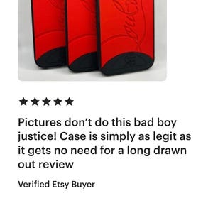 May include: Three red phone cases with black trim. The cases have a curved design and a logo in a cursive font. The cases are displayed against a white background.
