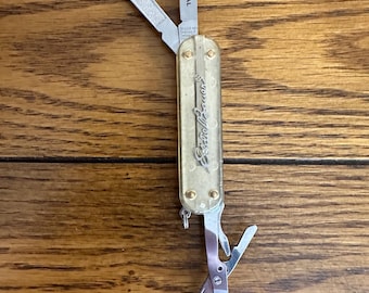 Vintage translucent Eddie Bauer Wenger Delemont 65mm Swiss army knife, see/read