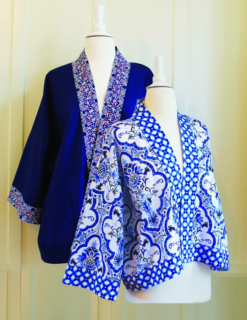 May include: Two blue and white patterned jackets with a kimono style. The jacket on the left is a solid blue with a white and red patterned trim. The jacket on the right has a white background with a blue and white floral pattern.