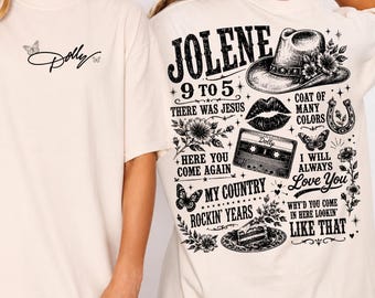 May include: A cream-colored t-shirt featuring a small black script logo reading Dolly with two butterflies on the front. The back displays a large black graphic with a cowboy hat, cassette tape, lips, and text including Jolene and 9 to 5.