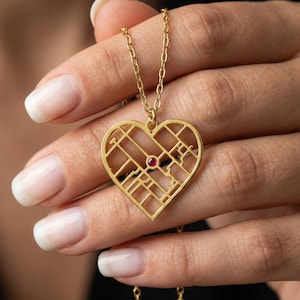 May include: A handmade, wooden cutting board with a natural finish. The board features a live edge on one side and a rectangular shape. It is approximately 18 inches long and 12 inches wide.