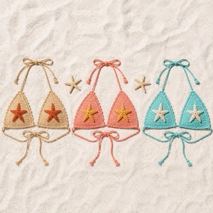 May include: Three handmade crochet bikini tops in beige, coral, and turquoise, each adorned with a starfish applique. The tops are tied with matching string and are displayed on a sandy surface.