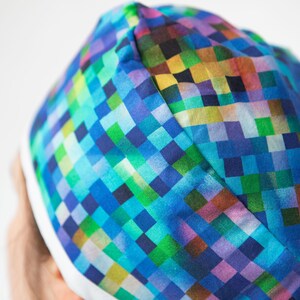 Rainbow pixel style print scrub cap that covers the whole head. Ideal for short but if hair is worn braided and pinned up can work for long hair too. Y2K, Medical surgical research Analyst, Ombre rainbow, Clinical Trial Tech, Surgical Study resident