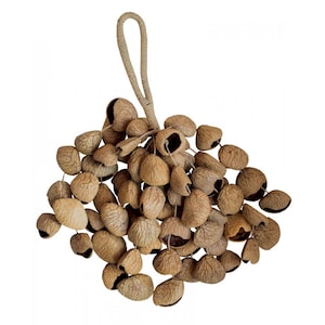 May include: A cluster of brown seed pods, likely used as a musical instrument, with a loop of natural-colored rope for hanging. The pods have a textured surface and are tied together.