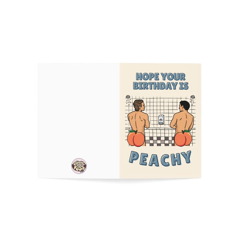 May include: A folded greeting card with a humorous illustration. The card features two figures with peach-shaped bottoms in a shower setting, with the text "HOPE YOUR BIRTHDAY IS PEACHY". The card has a white background.