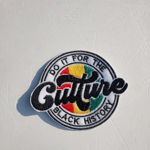 May include: A black and white embroidered patch with the text "Do it for the Culture Black History" in a circle. The circle has a red, yellow, and green design in the center.