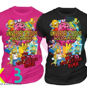 May include: Two t-shirts, one pink and one black, featuring a colorful graphic design. The design includes the text "Universal Studios Hollywood" and "The Best Vacation Ever" with cartoon characters and a donut.