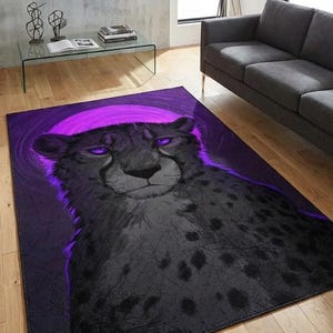 May include: A rectangular area rug featuring a stylized cheetah portrait with purple eyes and a purple halo against a dark background. The cheetah's fur is primarily gray with black spots. The rug is placed on a hardwood floor.
