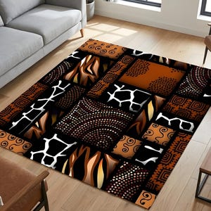 May include: Area rug with a patchwork design featuring geometric and animal print patterns in black, brown, and white. The rug has a rectangular shape and is placed on a wooden floor.