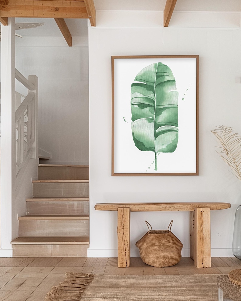 Watercolor banana leaf art print with lush green tones, perfect for tropical and botanical wall decor. Minimalist design captures nature-inspired style, adding a refreshing vibe to modern, bohemian, or office spaces. Unframed, ready to be styled