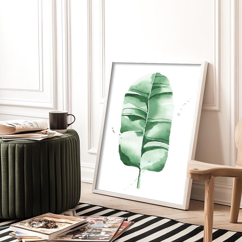Watercolor banana leaf art print with lush green tones, perfect for tropical and botanical wall decor. Minimalist design captures nature-inspired style, adding a refreshing vibe to modern, bohemian, or office spaces. Unframed, ready to be styled