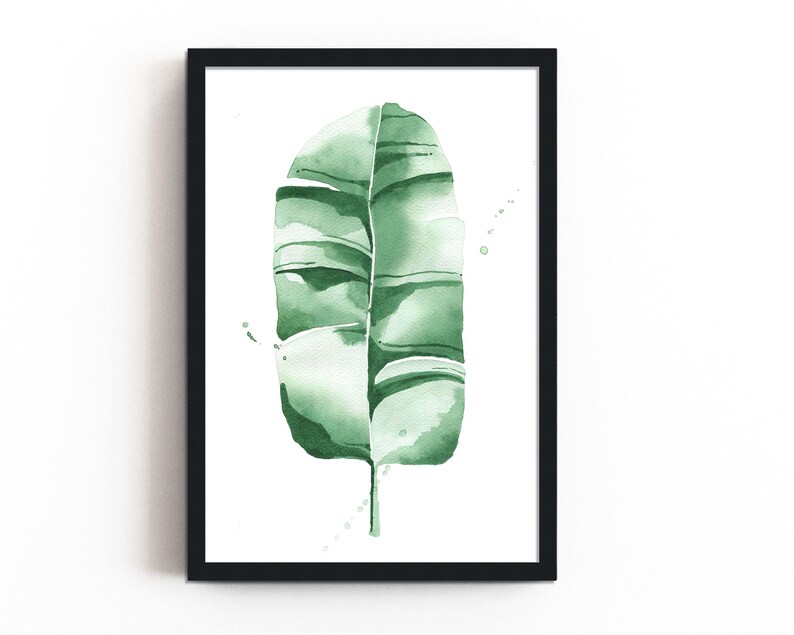 Watercolor banana leaf art print with lush green tones, perfect for tropical and botanical wall decor. Minimalist design captures nature-inspired style, adding a refreshing vibe to modern, bohemian, or office spaces. Unframed, ready to be styled