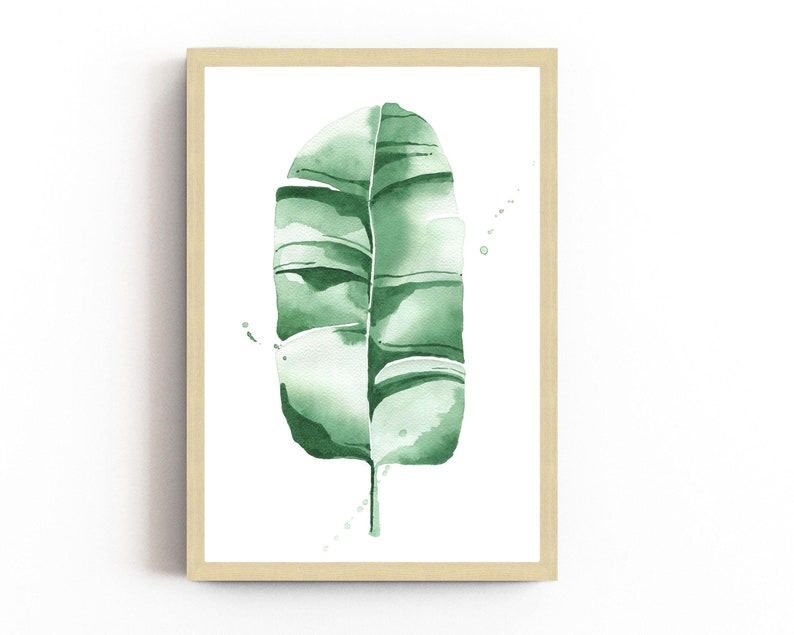 Watercolor banana leaf art print with lush green tones, perfect for tropical and botanical wall decor. Minimalist design captures nature-inspired style, adding a refreshing vibe to modern, bohemian, or office spaces. Unframed, ready to be styled
