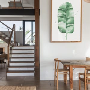 Watercolor banana leaf art print with lush green tones, perfect for tropical and botanical wall decor. Minimalist design captures nature-inspired style, adding a refreshing vibe to modern, bohemian, or office spaces. Unframed, ready to be styled