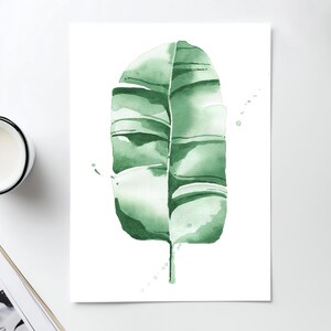 Watercolor banana leaf art print with lush green tones, perfect for tropical and botanical wall decor. Minimalist design captures nature-inspired style, adding a refreshing vibe to modern, bohemian, or office spaces. Unframed, ready to be styled